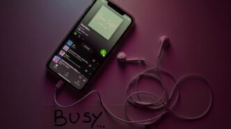 black android smartphone on white surface, spotify listening